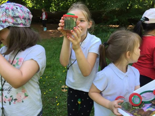 children holding water jars