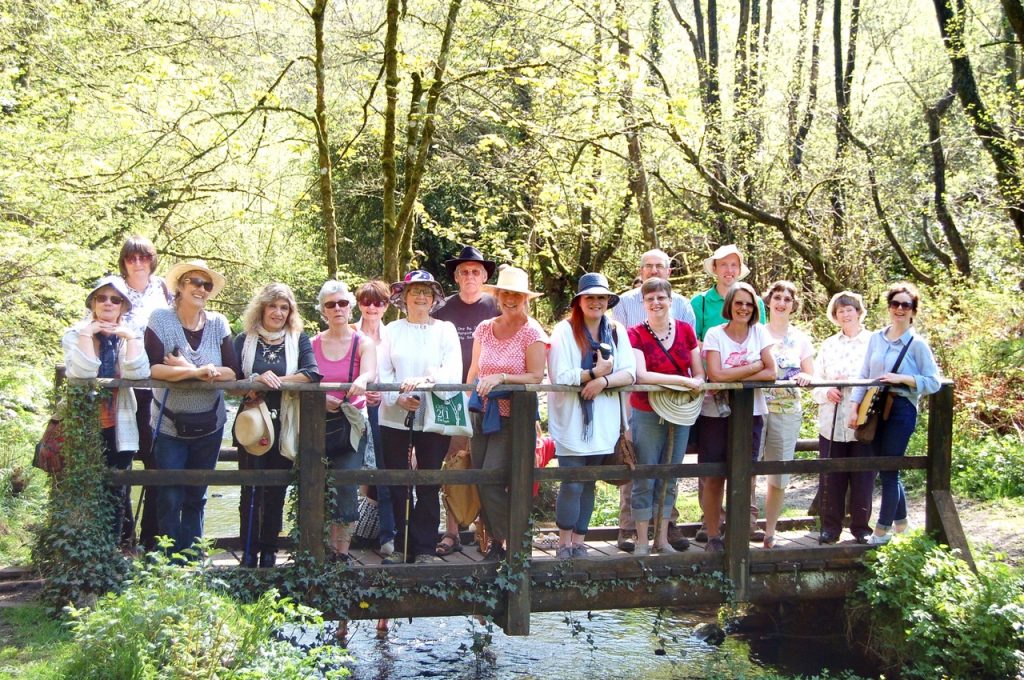 The Sing and Stroll participants at Otterhead Lake posing on the footbridge for a photo.