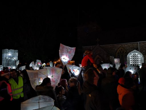 Hemyock annual lights parade with lots of people gathered holding lanterns