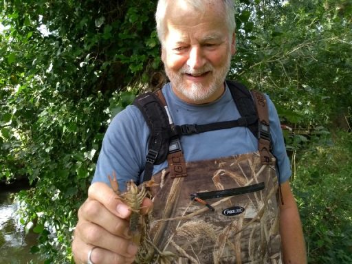 Bruce Payne holding a crayfish