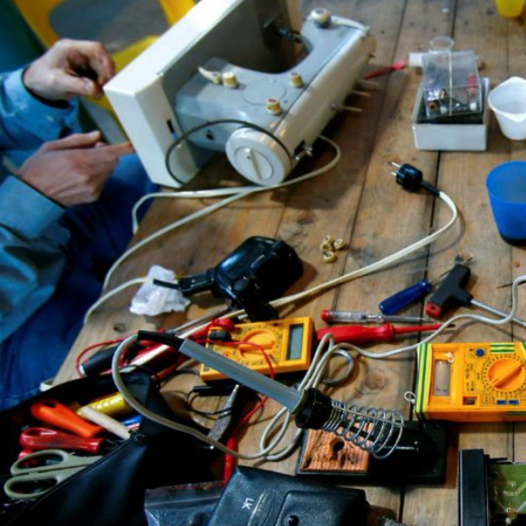 Broken electrical items being fixed on a a work bench