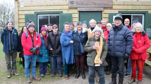 George Pidgeon with a group of people standing in front of John Greenshields visitor centre