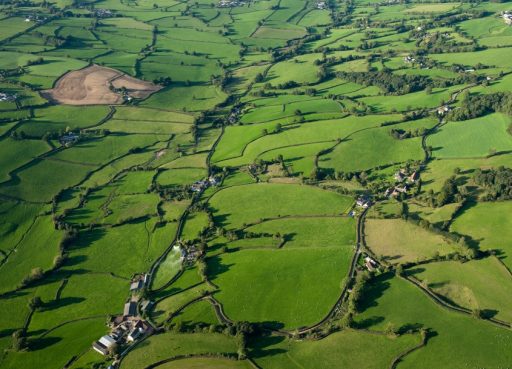 An aerial photograph showing fields and hedgerows and other landscape features.
