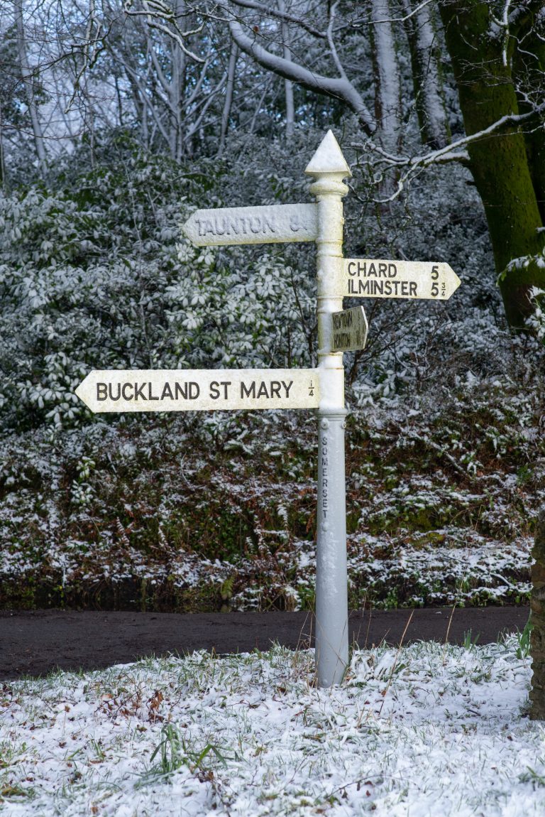 Finger post road sign in the snow